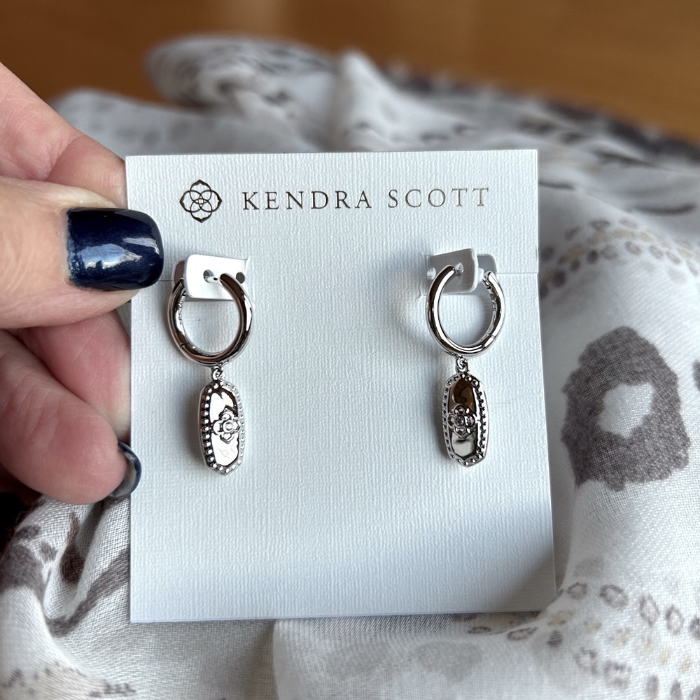 ***SOLD***  Kendra Scott Rue huggie earrings in Silver.  Brand New!